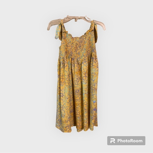 Girl's Batik Ball mustard-colored sundress with turquoise/purple‎ design.